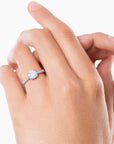 Moonstone solitaire ring worn on finger – elegant sterling silver birthstone ring for women