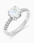 Natural round moonstone ring with sparkling side stones – dainty June birthstone jewellery