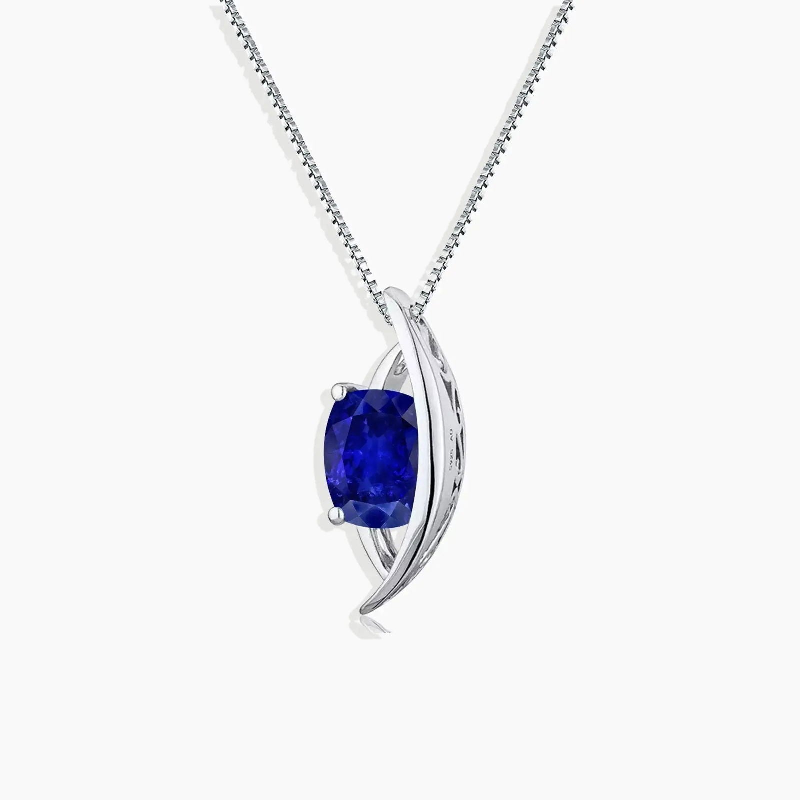 Elegant September birthstone necklace featuring a deep blue sapphire in a sterling silver curved setting, perfect for celebrating September birthdays.