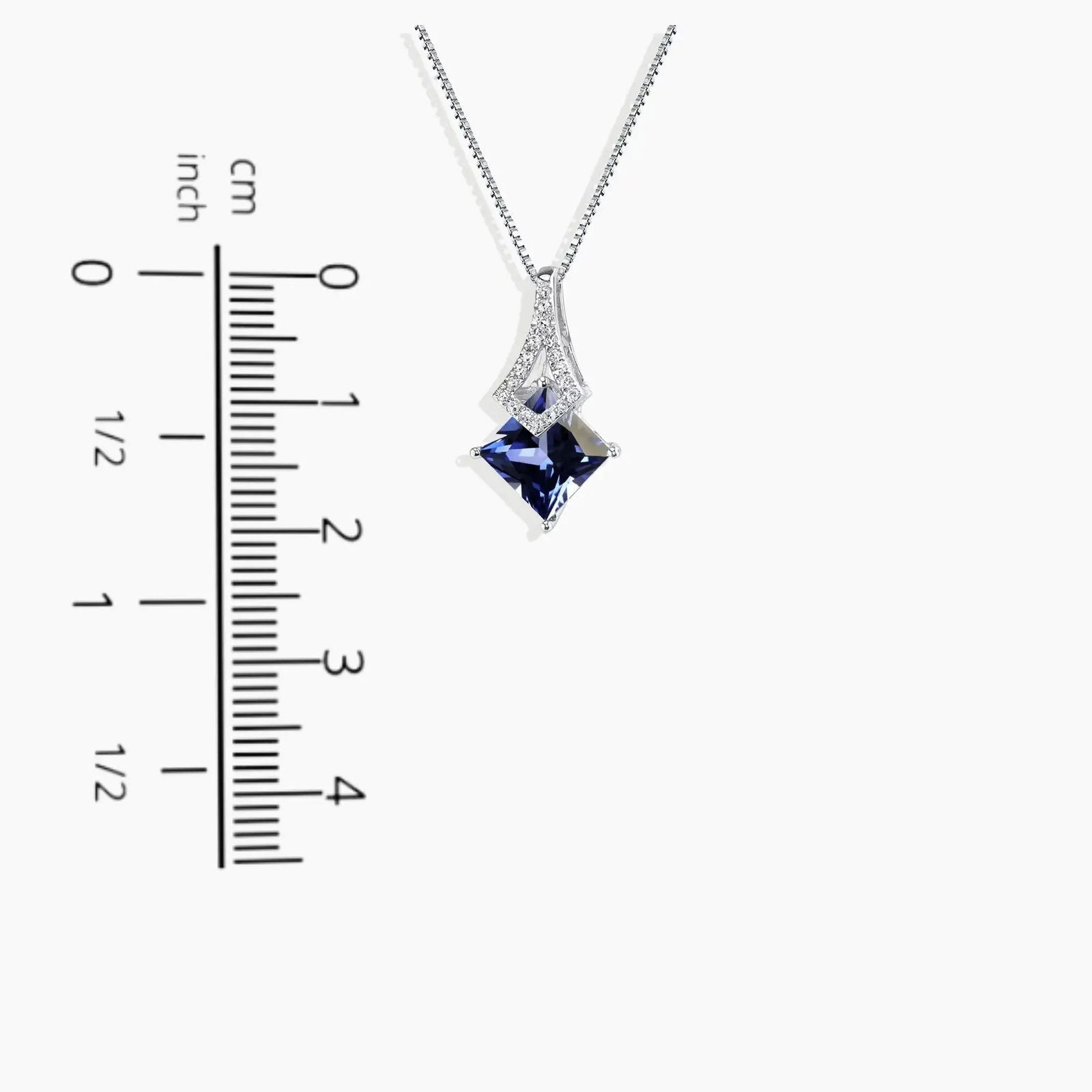 princess cut sapphire necklace next to scale