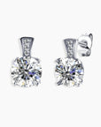 Pair of 1ct Scintillating Moissanite Stud Earrings in sterling silver, displayed against a white background.