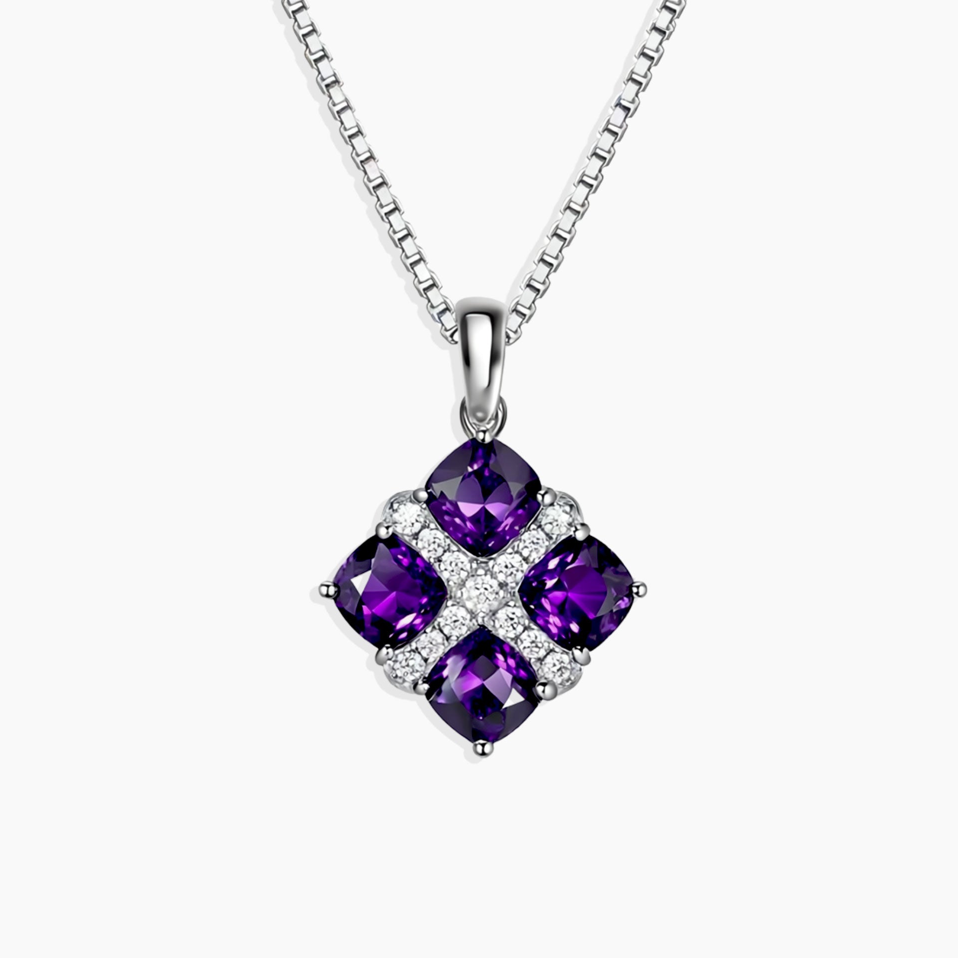 Regal Amethyst Cluster Pendant featuring four square-cut natural amethysts set in rhodium-plated sterling silver on a 45 cm box chain.