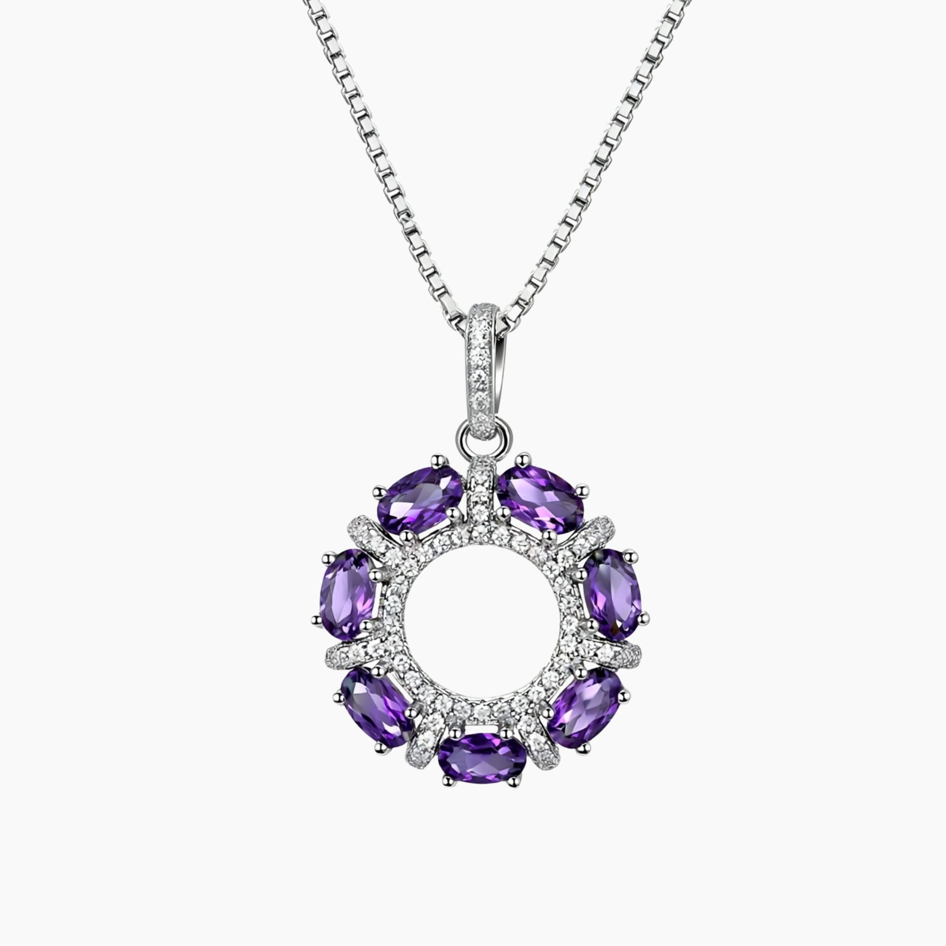 Luxury sterling silver halo pendant featuring seven oval-cut natural amethysts in a circular setting, paired with a fine box chain.