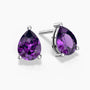 Teardrop-shaped amethyst stud earrings in silver claw setting
