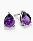 Teardrop-shaped amethyst stud earrings in silver claw setting