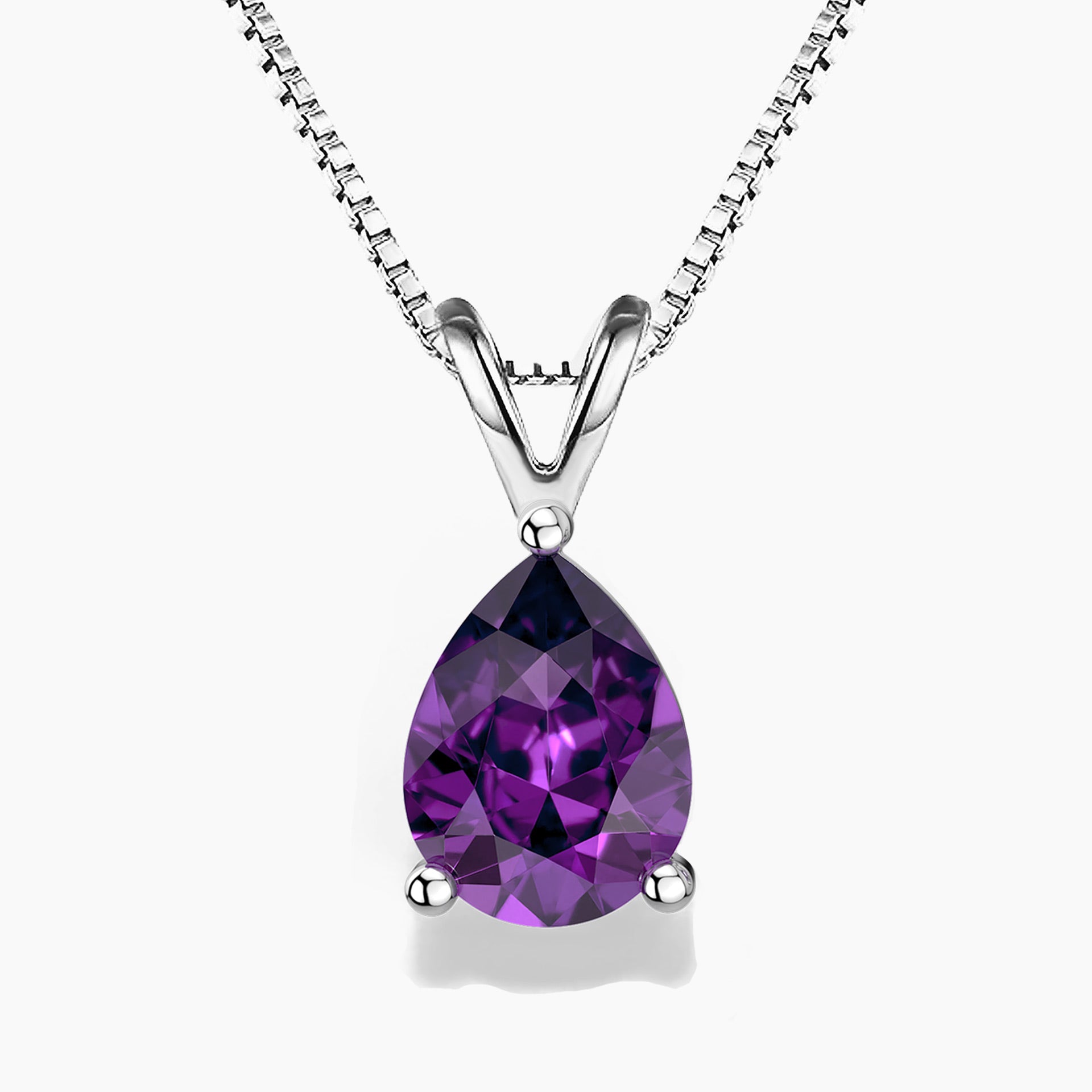Pear-shaped amethyst pendant necklace in silver claw setting on a box chain