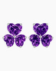 Purple butterfly-shaped earrings on a white background
