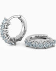 Pair of aquamarine huggie earrings in rhodium-plated sterling silver.