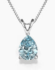 Teardrop-shaped aquamarine pendant necklace in silver claw setting on a box chain
