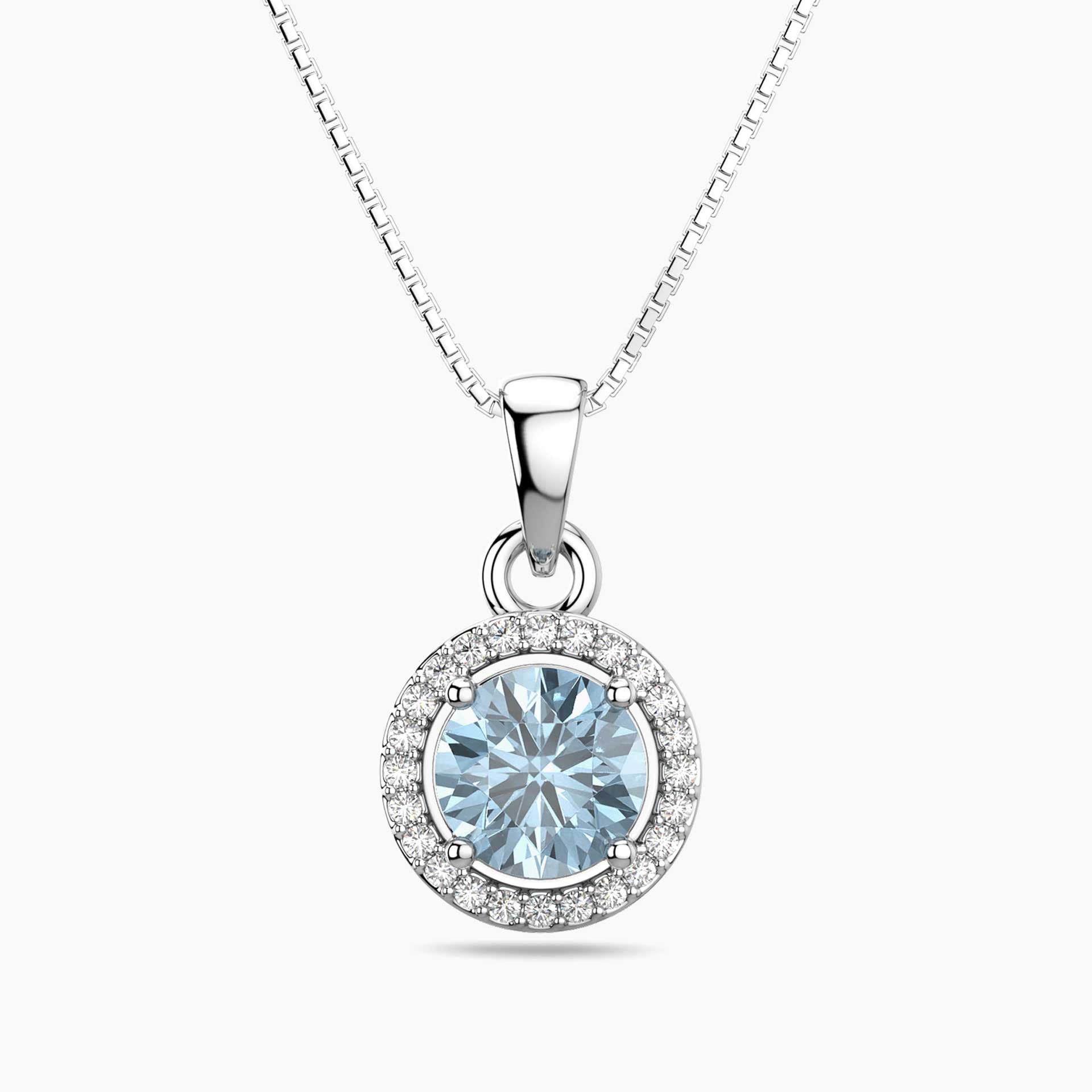 Silver pendant with a blue aquamarine gemstone on a white background