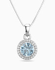 Silver pendant with a blue aquamarine gemstone on a white background