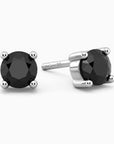 A pair of round shape stud earrings with black onyx gemstones set in sterling silver.
