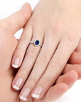 Oval-cut sapphire ring with halo design