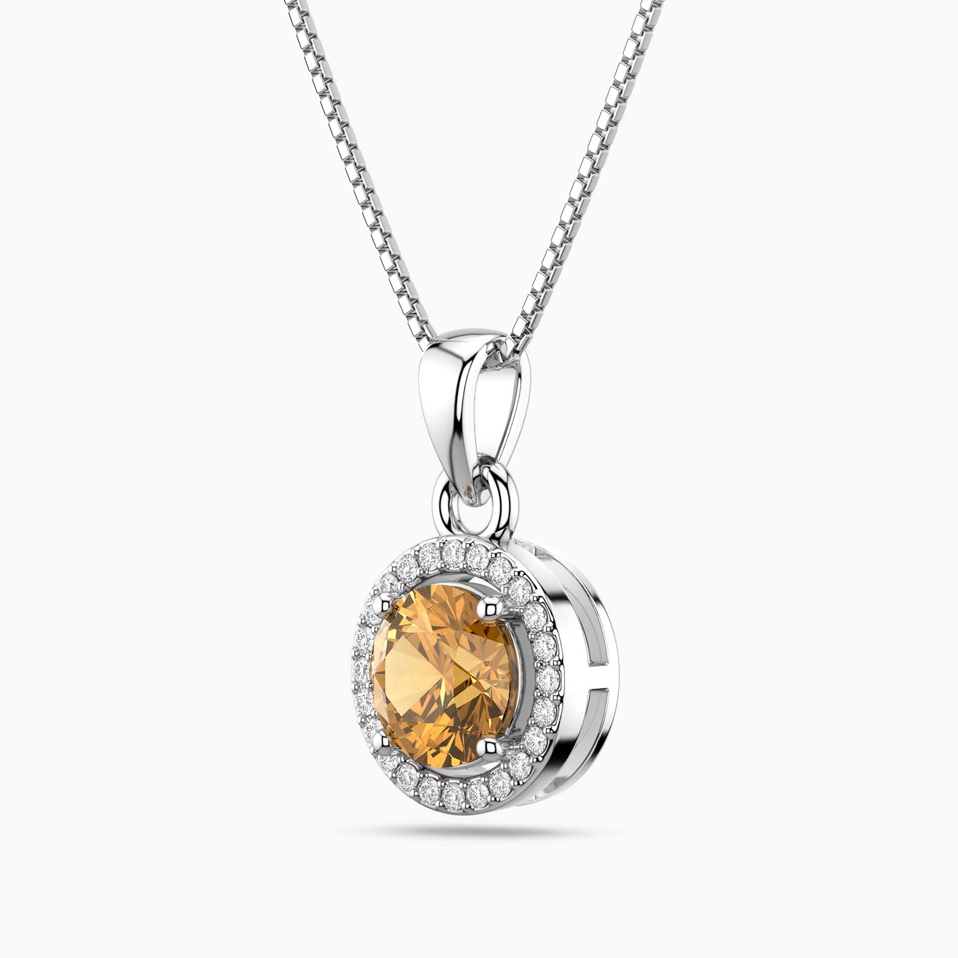 Silver citrine pendant with a yellow gemstone and clear stones on a white background