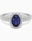 Classic oval sapphire halo ring in sterling silver