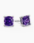 Cushion-cut amethyst stud earrings in sterling silver, showcasing deep purple gemstones in classic four-prong settings.