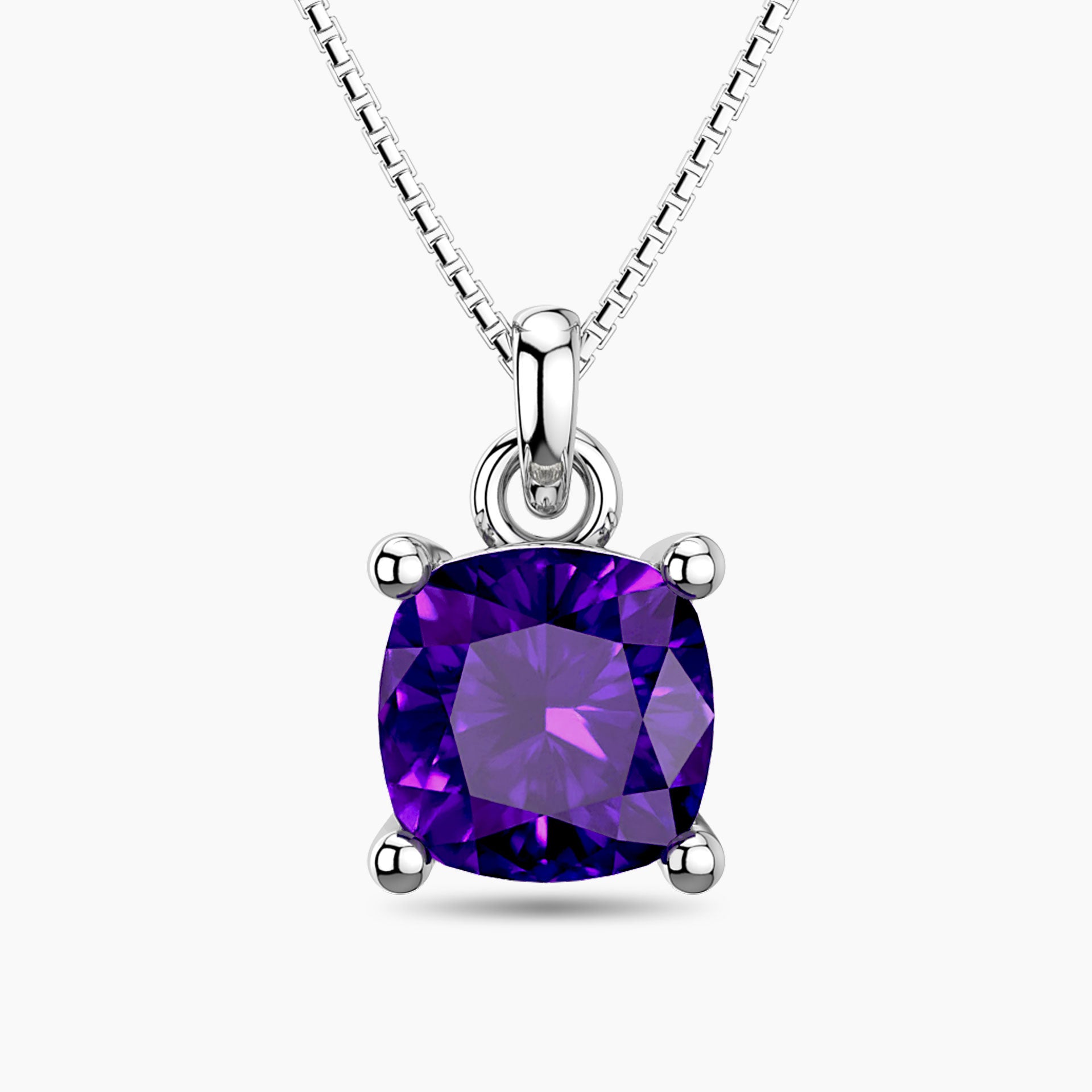 Cushion-cut amethyst pendant necklace in sterling silver with a box chain, featuring a vibrant purple gemstone in a four-prong setting.