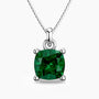 Cushion-cut emerald pendant in sterling silver with a box chain, featuring a vivid green gemstone in a four-prong setting.