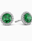 Sterling silver halo stud earrings with a 6 mm lab-created emerald center and a halo of diamond stimulant accents.