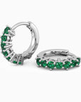 Sterling silver huggie earrings with a row of 2.5 mm round lab-created emeralds, showcasing a 15 mm hoop design.