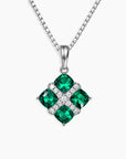 Lab-Created Emerald Cluster Pendant with four cushion-cut emeralds in rhodium-plated sterling silver on a 45 cm box chain.