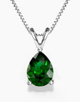 Teardrop-shaped emerald green pendant necklace in silver claw setting on a box chain