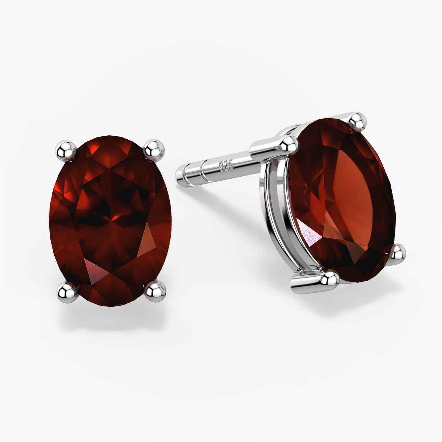 oval shape garnet earrings in white background