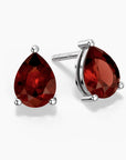 Pear-shaped garnet stud earrings in sterling silver setting