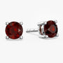 round shape garnet studs on white background