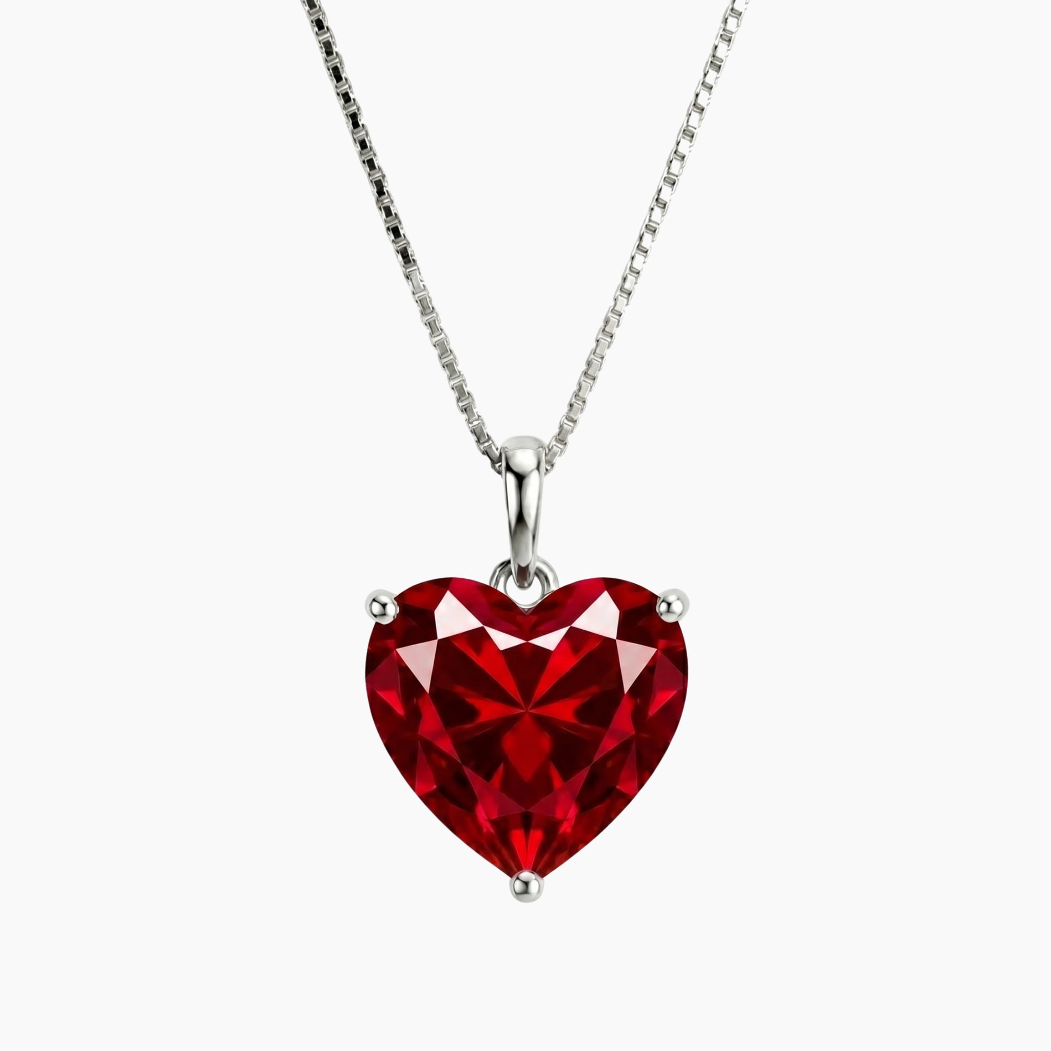 Red ruby heart-shaped gemstone necklace on a white background
