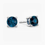 Pair of london blue topaz gemstone stud earrings on a white background