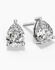 Teardrop-shaped moissanite stud earrings in silver claw setting