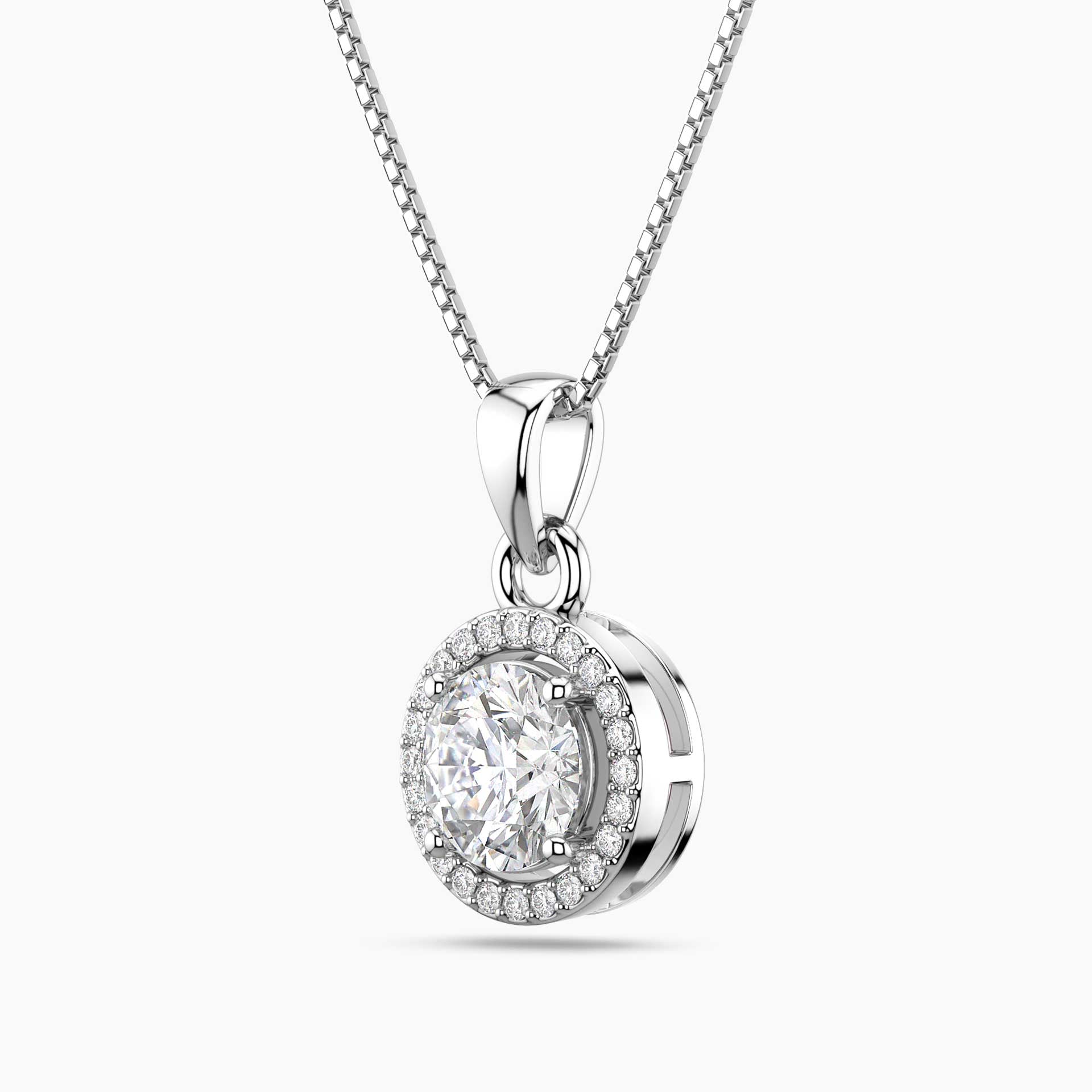 Silver pendant necklace with a clear moissanite on a white background