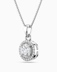 Silver pendant necklace with a clear moissanite on a white background