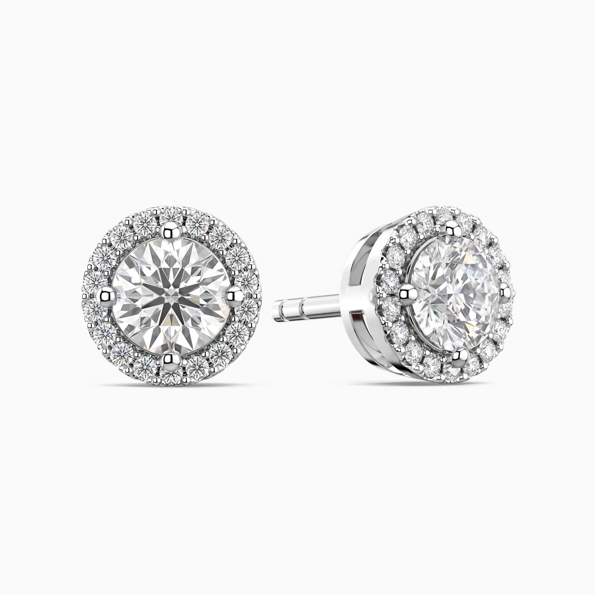 Pair of diamond moissanite earrings on a white background