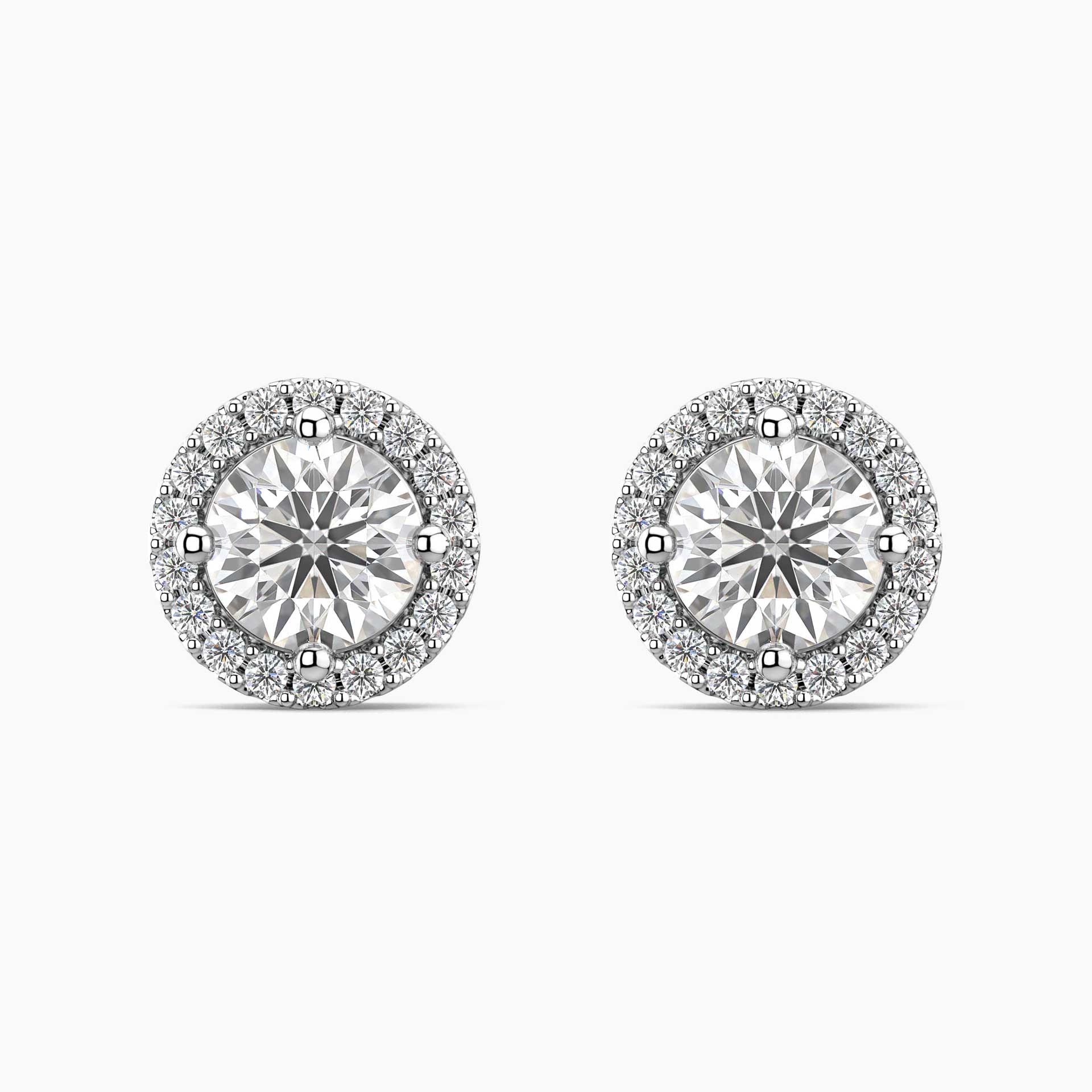 Pair of moissanite stud earrings on a white background