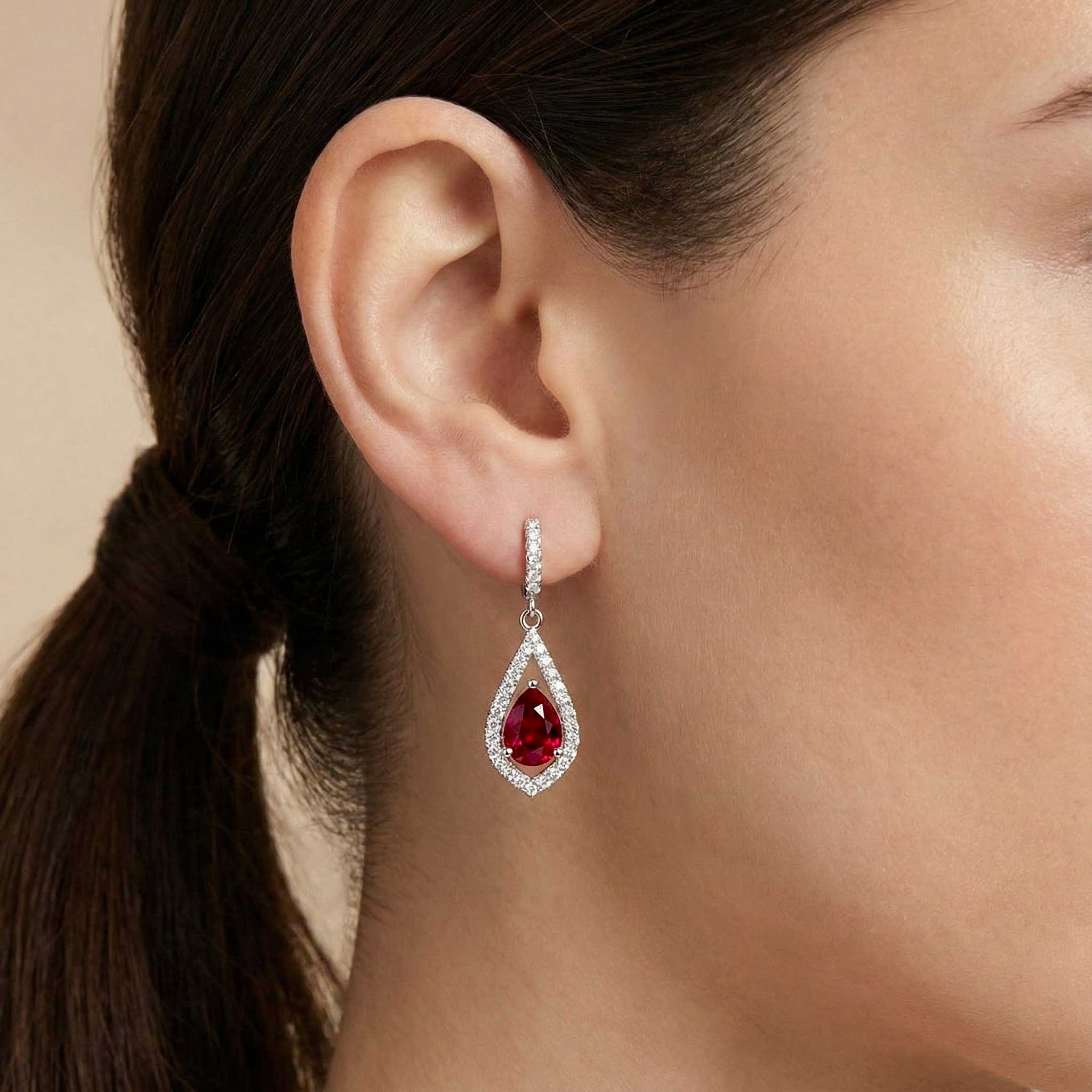 pear ruby drop earrings on model