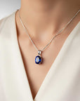 Necklace with a blue pendant on a mannequin wearing a white blouse