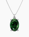 Oval-cut deep green gemstone pendant in a four-prong silver setting, hanging from a sleek silver box chain, displayed on a white background