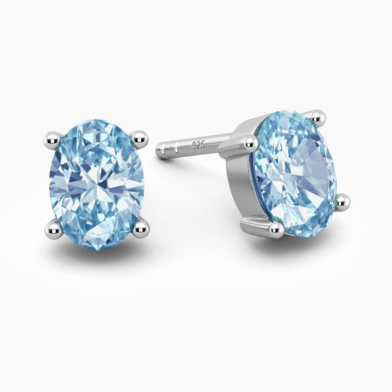 swiss blue topaz oval shape studs