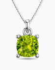 Sterling silver necklace featuring a cushion-cut green peridot pendant in a four-prong setting on a box chain.