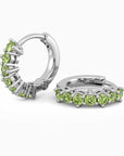 Peridot Silver Huggie Earrings in elegant round shape with natural gemstones, August birthstone set in rhodium-plated sterling silver.