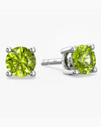 Pair of green  peridot gemstone stud earrings on a white background