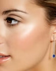 video of sapphire dangle earrings on model