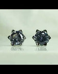 Video preview of Alexandrite hexagon earrings showing gemstone colour change in light