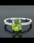 Video showcasing the Oval Peridot Silver Ring with Sparkling CZ Side Stones
