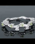 Video preview of a silver peridot ring with a celestial design, accented by white zirconia stones.