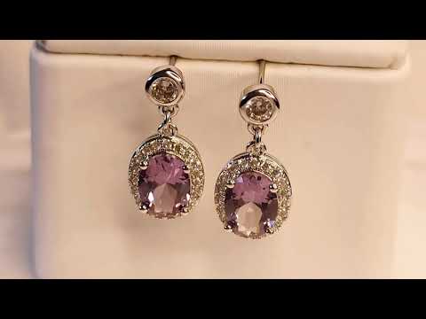 Alexandrite oval drop earrings shown in motion – highlighting gemstone sparkle and colour shift