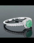 Video preview of the sterling silver round-cut emerald halo ring, showcasing its halo design and sparkling CZ accents.