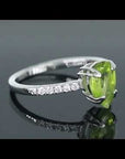 Video preview of Pear Cut Peridot Ring, demonstrating its sleek design and vibrant August birthstone in stunning detail.